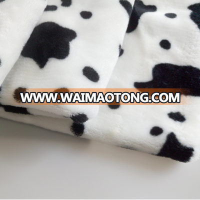 China suppliers cheap wholesale cow print flannel fabric for baby blanket